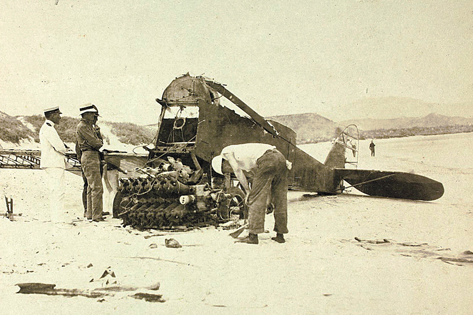 American military personnel examine the partially disassembled DH-4, found 20 miles north of the location of the crew’s remains. (Aviation History Collection/Alamy)