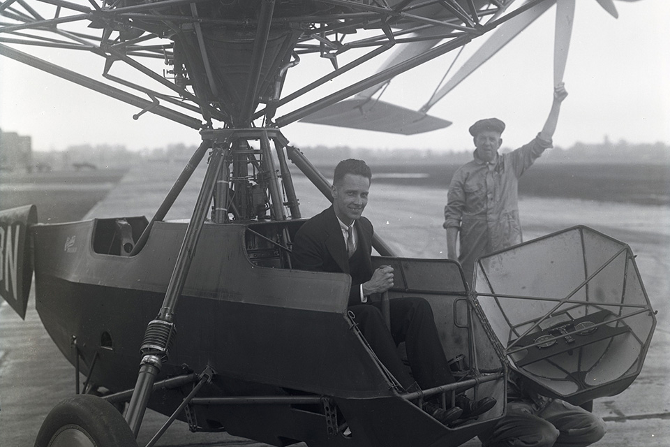 Bleecker grins from the cockpit of his flying machine, while mechanic Al Blashiel looks on. (Courtesy of Allan Bleecker)