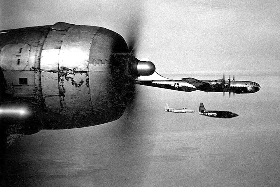 A second B-29 and a Lockheed F-80 accompany the B-29 mother ship as it unleashes the X-1. (U.S. Air Force)
