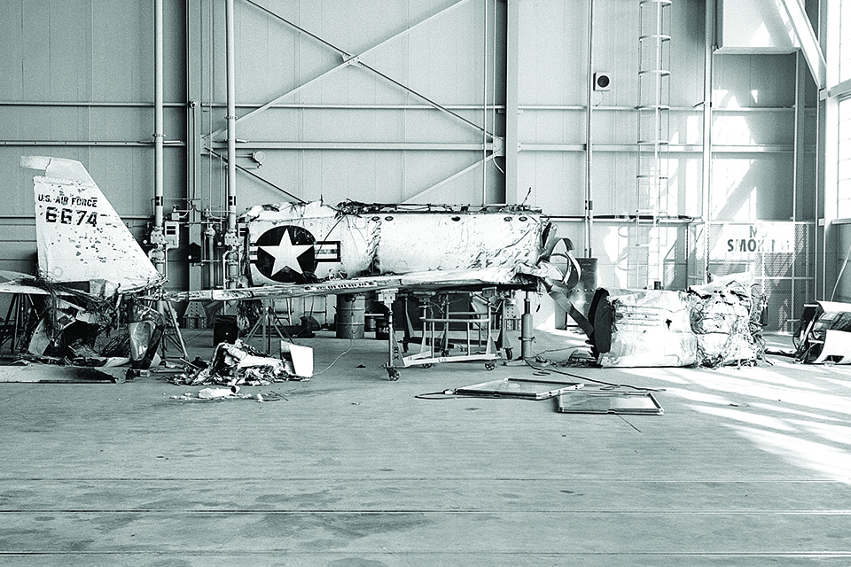 The first X-2 lies in pieces at the NACA High Speed Flight Station following the September 1956 crash that killed Apt. (NASA)