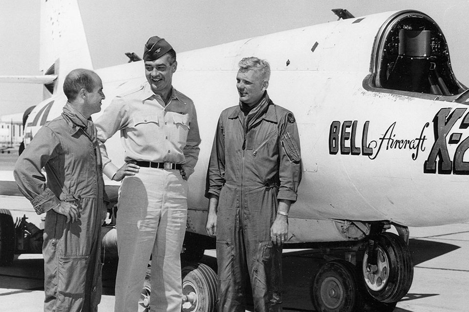 U.S. Air Force X-2 pilots Captain Milburn "Mel" Apt (left) and Captain Iven Kincheloe flank Colonel Horace Hanes, flight test director, beside the rocket plane in 1956. (U.S. Air Force)