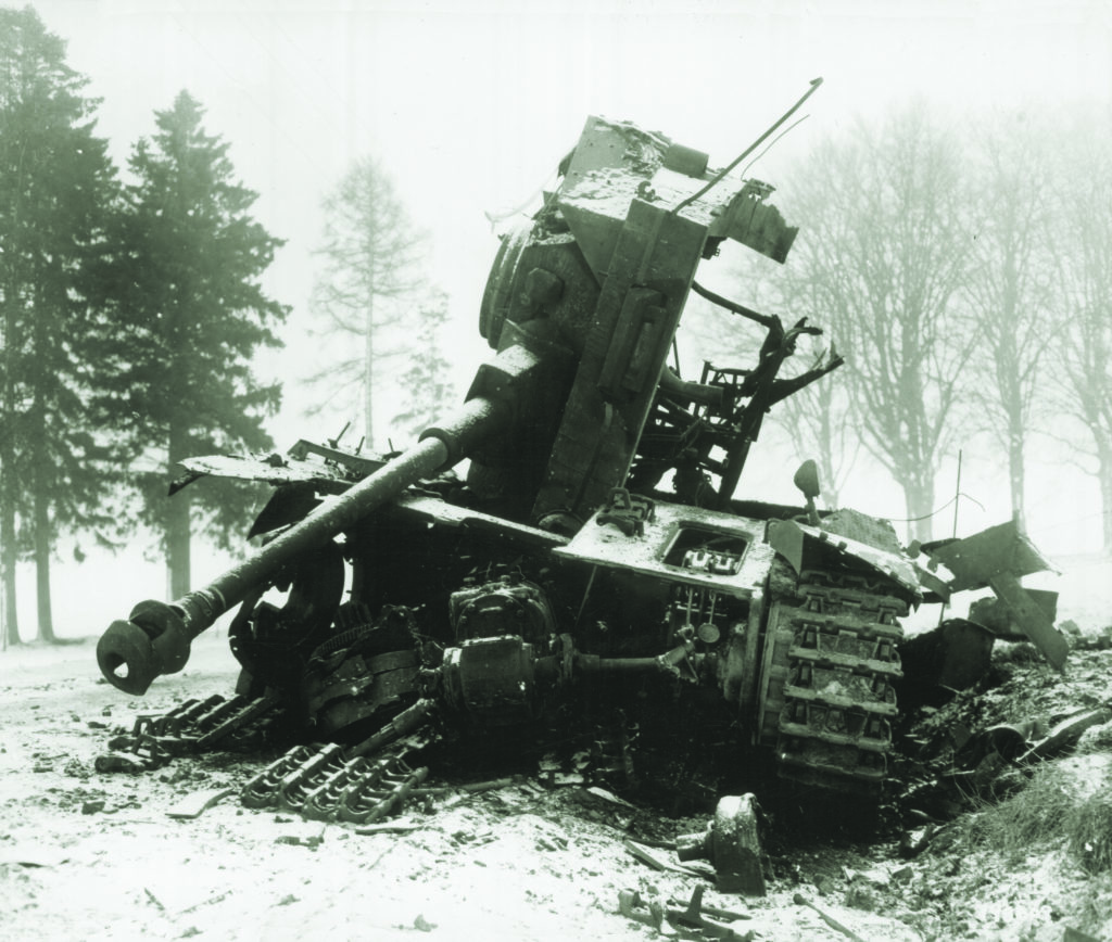 A German Panzer IV lies in ruin outside Bastogne. The German mainstay tank had its numbers greatly reduced even before the Battle of the Bulge began. NATIONAL ARCHIVES. 