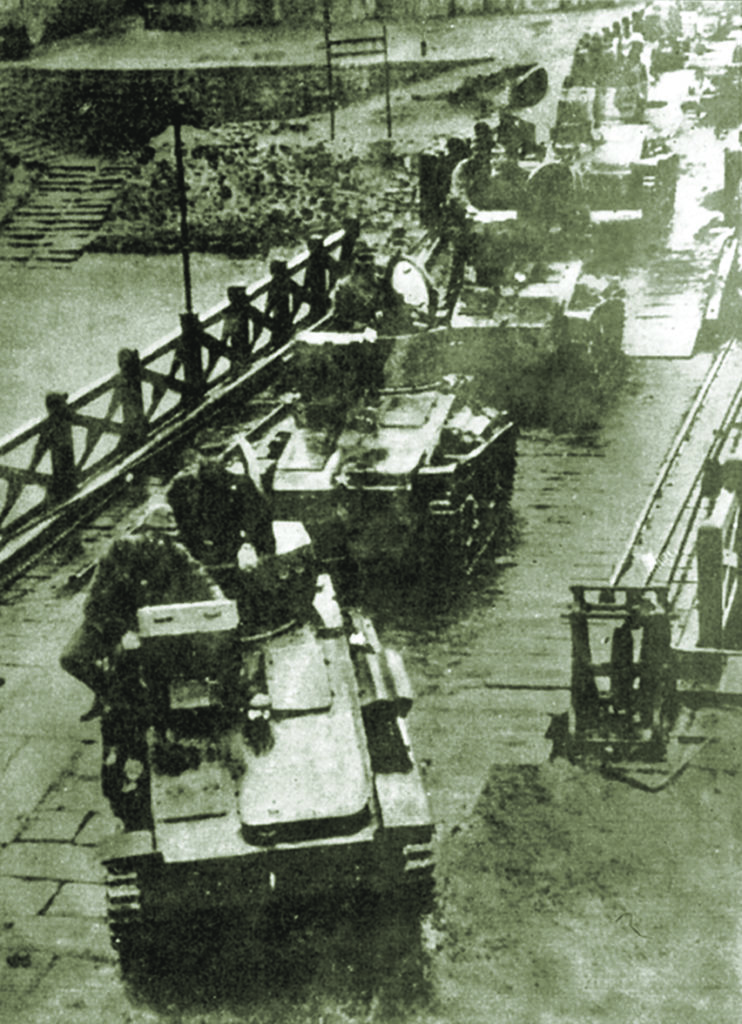Japanese troops in January 1942 advance from Malaya to Singapore via tank and improvised bridge (top and below); the successful overland attack was of Tsuji’s design. PICTURES FROM HISTORY/BRIDGEMAN IMAGES