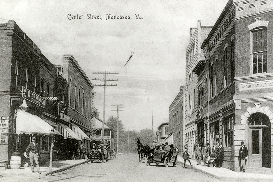 This photo of Center Street in Manassas, taken in 1915 or 1916, shows the appears of horseless carriages and telephone wire. (Courtesy of the Manassas Museum System, Manassas, Virginia) 