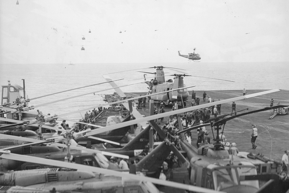 UH-1 Huey and CH-47 Chinook helicopters head to the deck of the USS Midway, already a cauldron of evacuees from Saigon during the last days of April 1975. (USS Midway Museum)