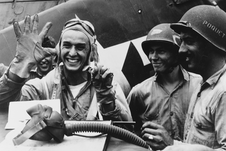 Vraciu holds up six fingers to signify his victories on June 19, 1944, during what came to be known as the “Great Marianas Turkey Shoot.” (U.S. Navy)