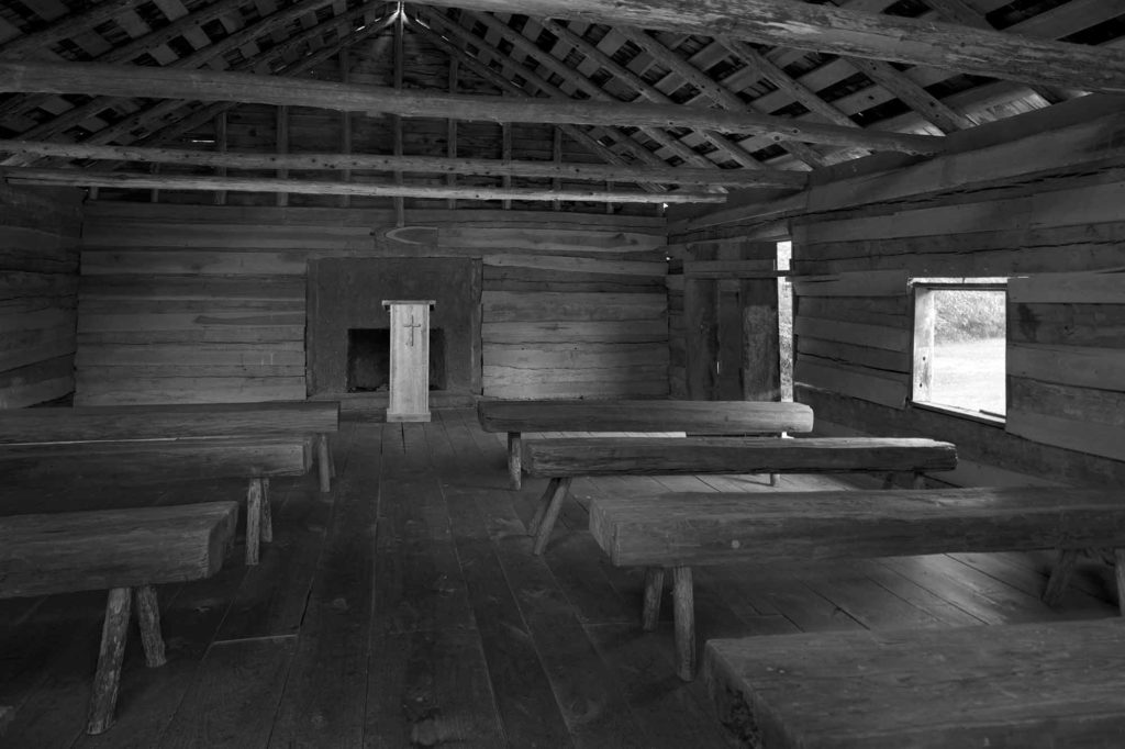 The Soul of Shiloh: In Will Gallagher’s photograph, morning light falls on empty pews in Shiloh church. The scene is ambivalent. Is this a place of peace or a place of desolation? Are the congregants dead, their church abandoned? Or maybe this church is about to flood with life? Perhaps the preacher will enter and pronounce a new sermon full of decency, humility, and truth. (Photo Copyright ©Will Gallagher)