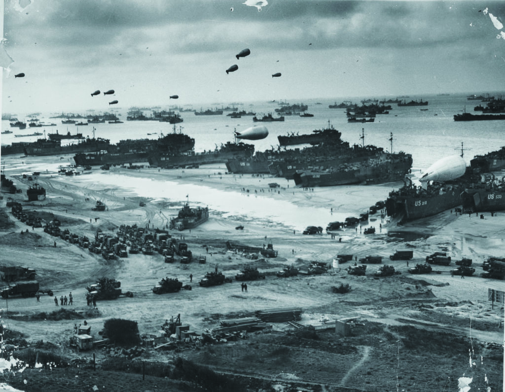 Within days of the  first assault, tens of thousands of Allied troops and weapons came ashore the  hard-won beaches  of Normandy. U.S. COAST GUARD/NATIONAL ARCHIVES 