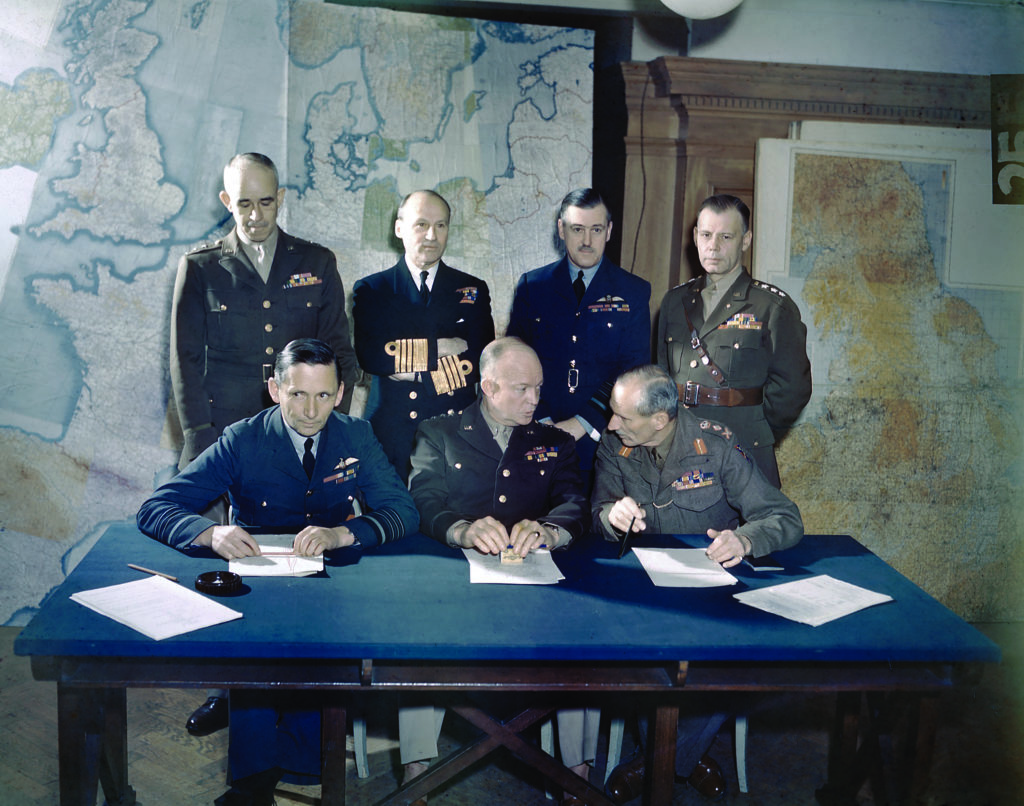 Supreme Commander Dwight D. Eisenhower (seated, center) and other leaders of the Allied Expeditionary Force organized history’s largest invasion.© IMPERIAL WAR MUSEUMS, TR 1631