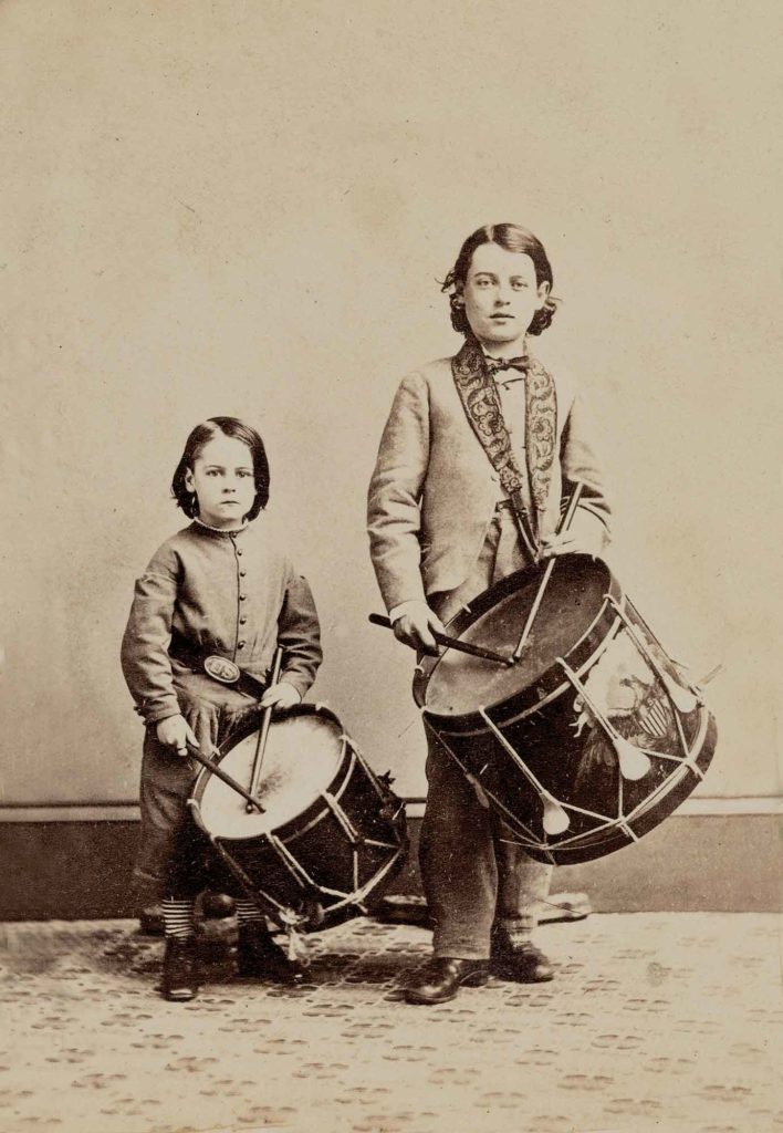 A magnificent eagle adorns the drum of the boy on the right, posing with a younger relative, possibly his brother. (Heritage Auctions, Dallas)