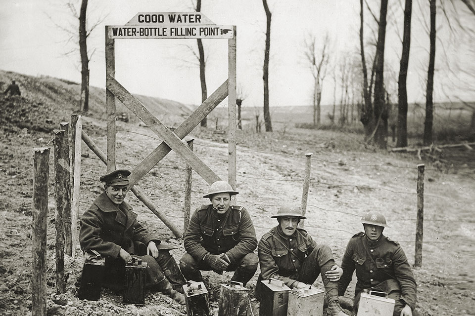 British soldiers pose in front of a “filling station” for clean water in World War I. (National Library of Scotland)