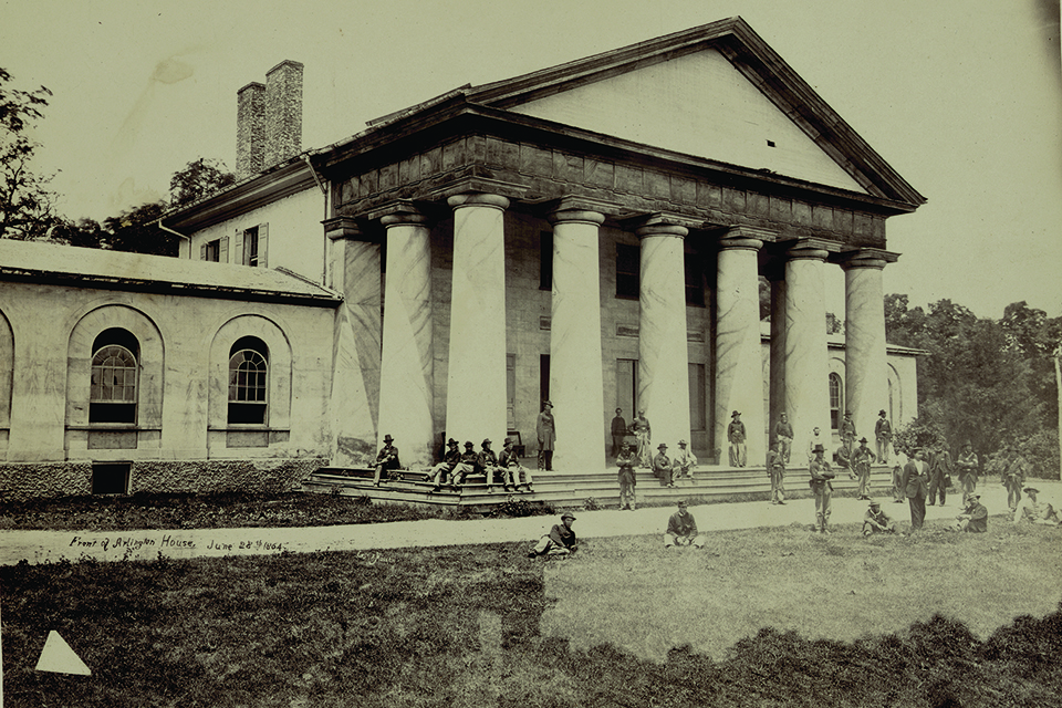 Robert Jr. grew up at Arlington Plantation while his father was stationed at army posts for long periods. This June 28, 1864, photo shows Union troops occupying the Lee home. (Library of Congress)