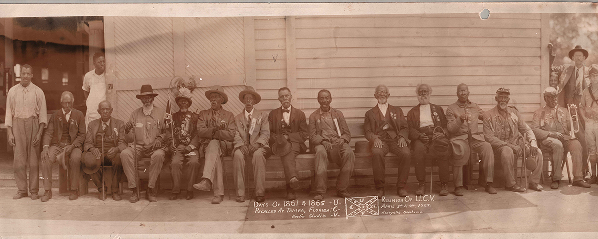Former Confederate camp slaves, some wearing ribbons proclaiming them as "ex slaves," attended a 1927 reunion in Tampa, Florida. These men formed bonds of camaraderie even while forced to serve a cause dedicated to keeping them in bondage. (National Civil War Museum)
