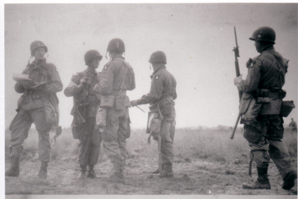 Commander of the 501st, Howard "Skeets" Johnson (second from left, top) stands facing the man who would replace him less than a month later., Julian J. Ewell. (U.S. Army)