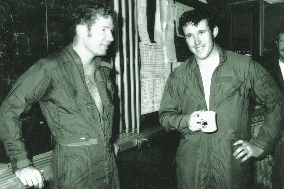 Lt. Randall “Duke” Cunningham, left, and Lt. j.g. William Driscoll relax aboard aircraft carrier USS Constellation on May 10, 1972, after three shootdowns that made them aces—the Navy’s only aces of the Vietnam War. (U.S. Navy)