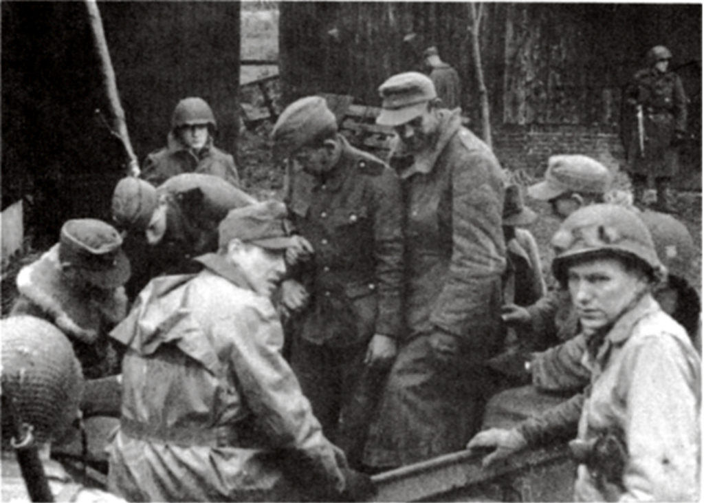 First Lieutenant Sims's patrol (pictured with seven German prisoners, above) covered only about five miles in enemy territory while netting a huge haul of prisoners. (U.S. Army) 