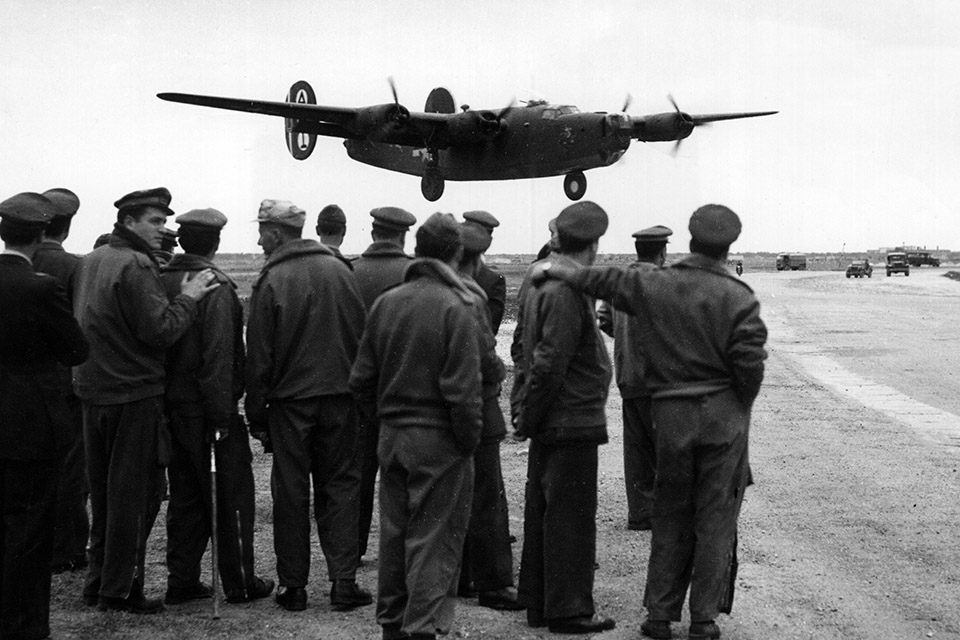 Allied airmen watch a B-24 return to Grottaglie from a bombing mission on May 25, 1944. On a run four days later, Two Ton Tessie did not come back. (Mondadori Portfolio via Getty Images)