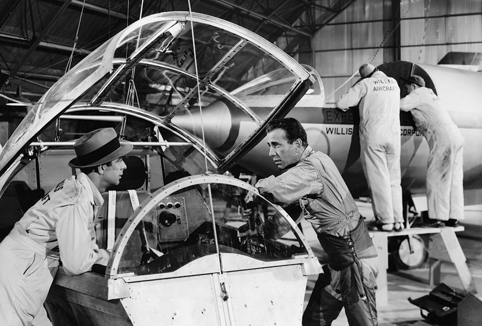 Humphrey Bogart (right) assesses the progress on the new Willis aircraft, in 1950’s "Chain Lightning." (Hulton Archive/Getty Images)
