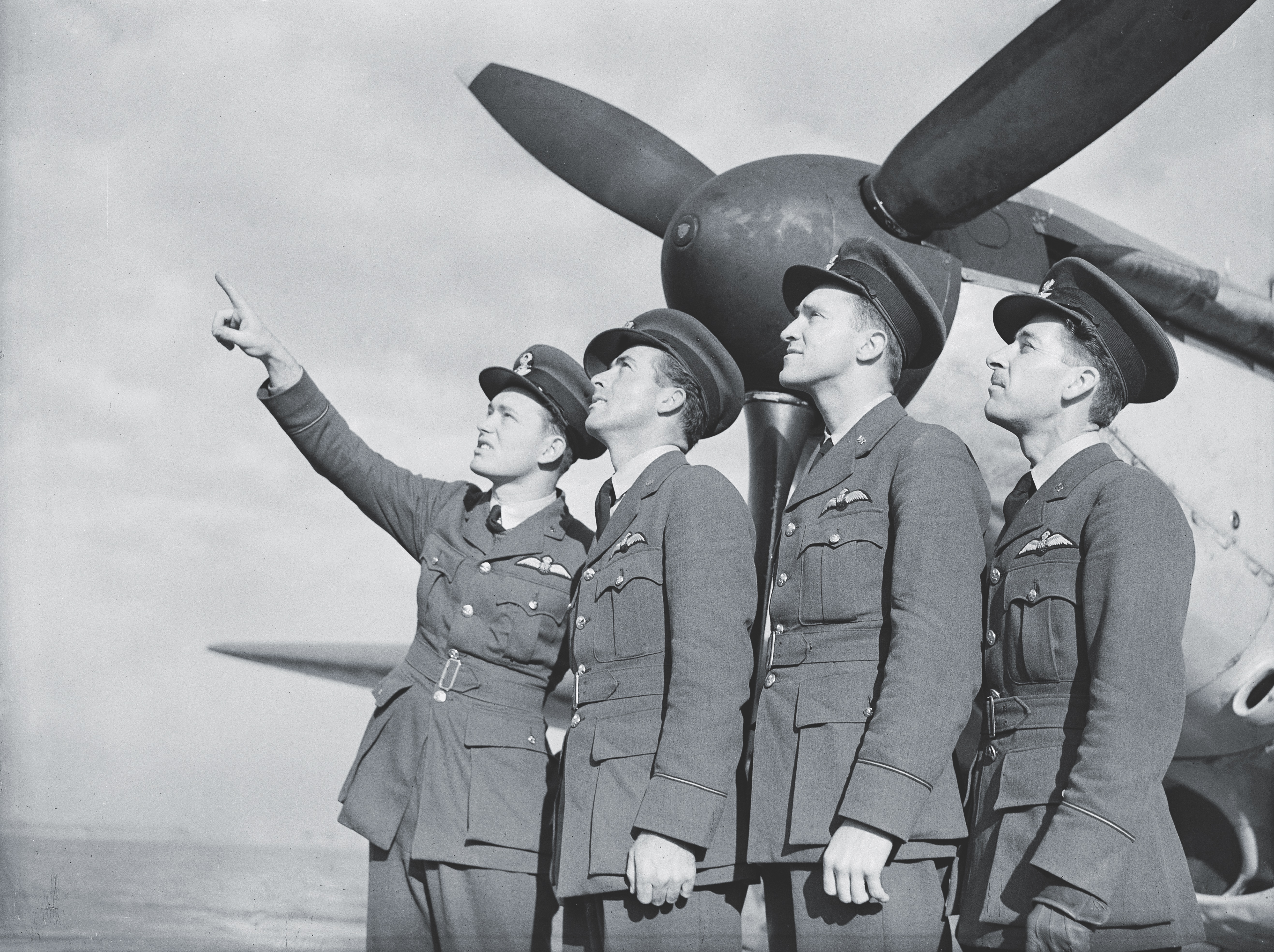 Edwin Orbison, Byron Kennerly, Richard Moore, and James McGinnis at an RAF Flying Training School in England. (Imperial War Museums)