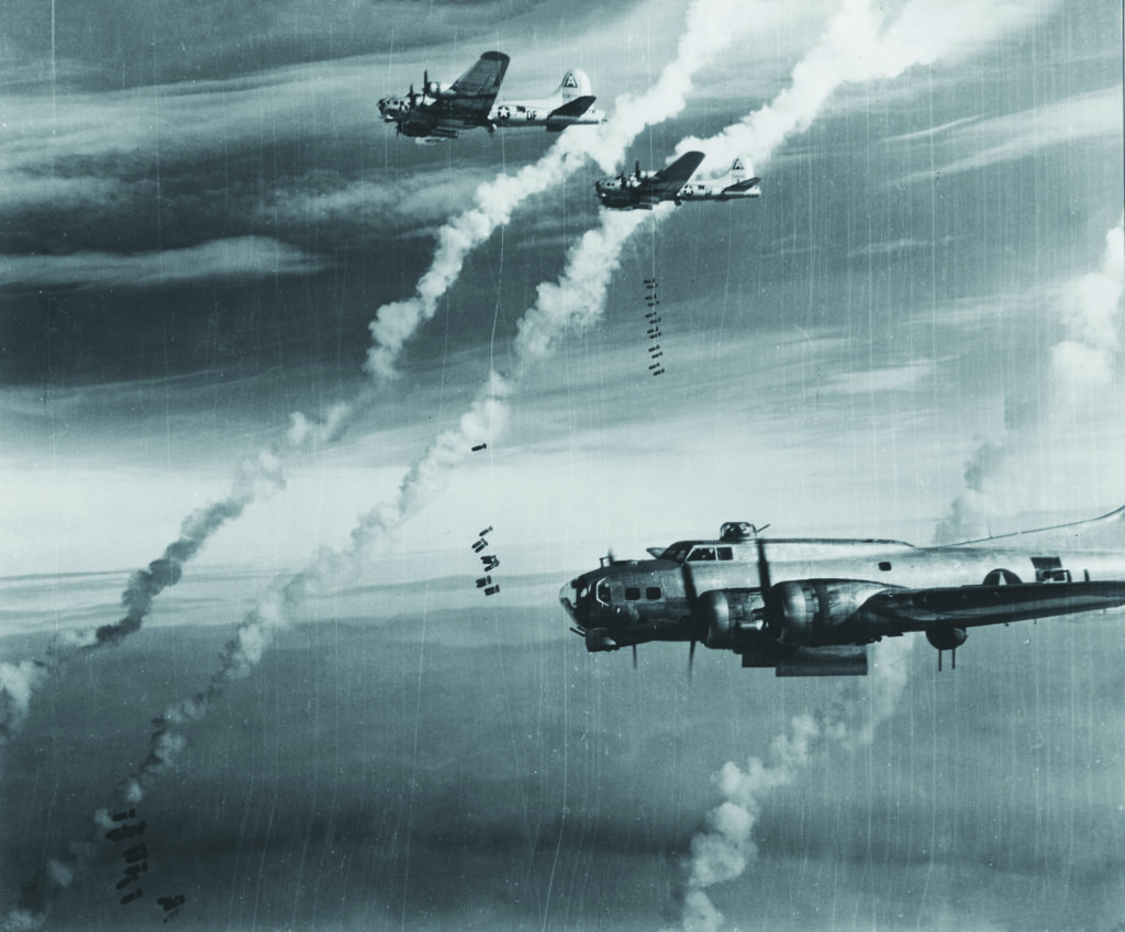 Heavy bombers of the Eighth Air Force—like these B-17s over Berlin in 1945 (above)—took the war to Germany in the face of Luftwaffe fighters and constant flak, making the 31 missions Hot Stuff (below) completed all the more impressive. (U.S. Air Force) 