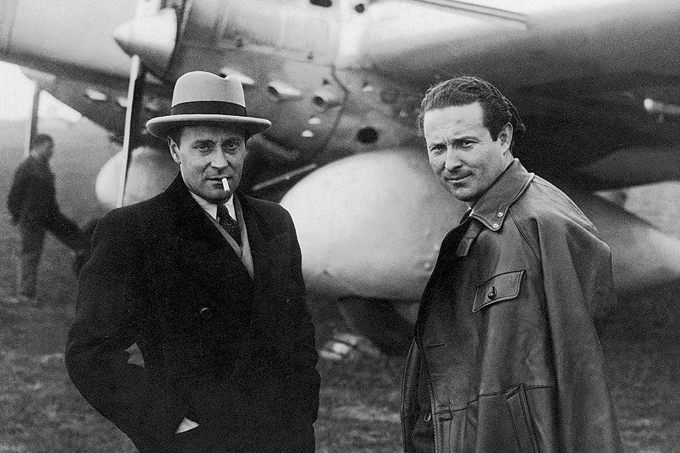 Jean Mermoz (right) regularly flew planes produced by manufacturer René Couzinet (left). (Keystone via Getty Images)
