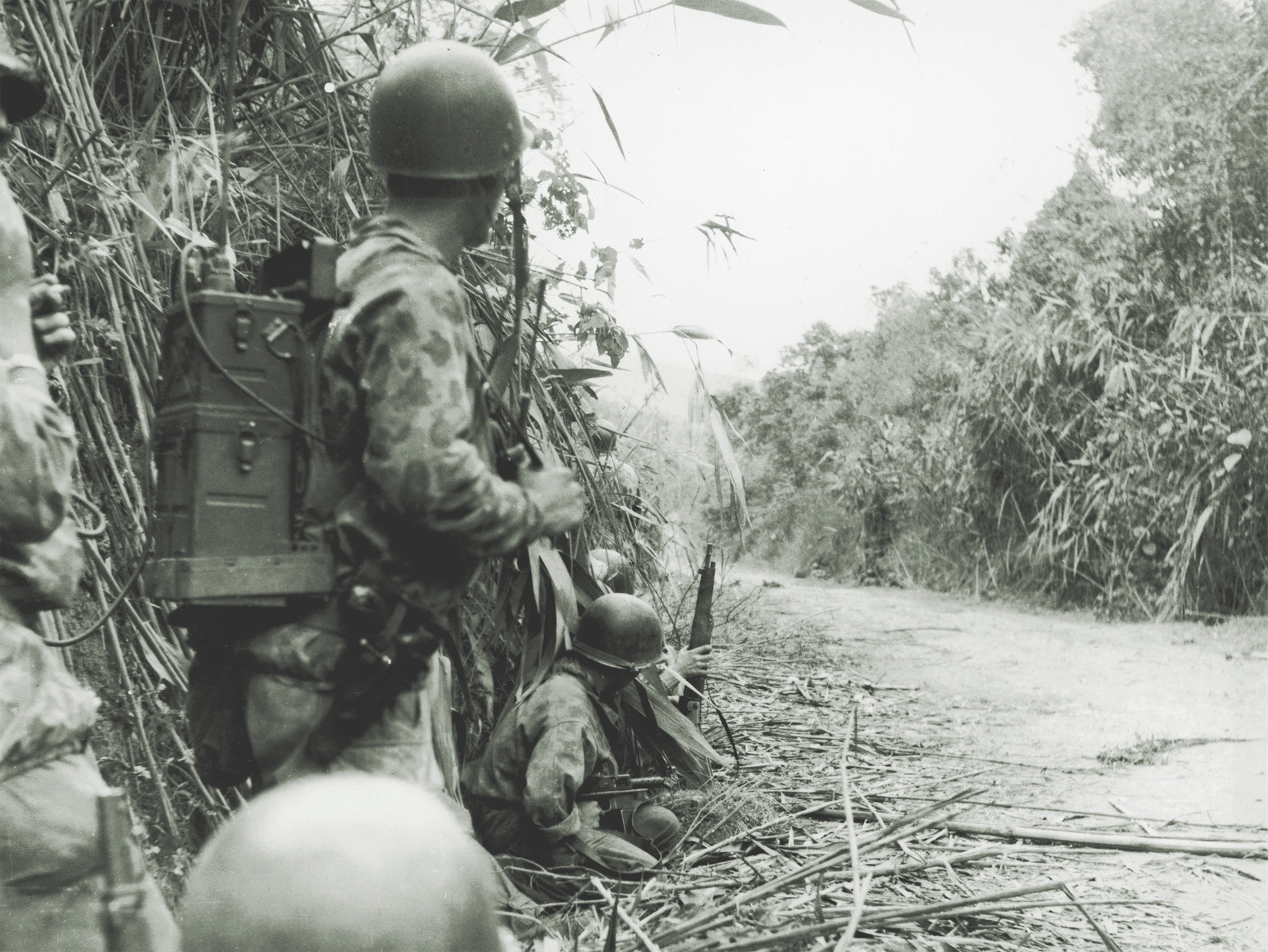 Having come under Vietminh fire, paratroopers of the French Foreign Legion warily scan the road ahead. (Hulton Archive, Getty Images)