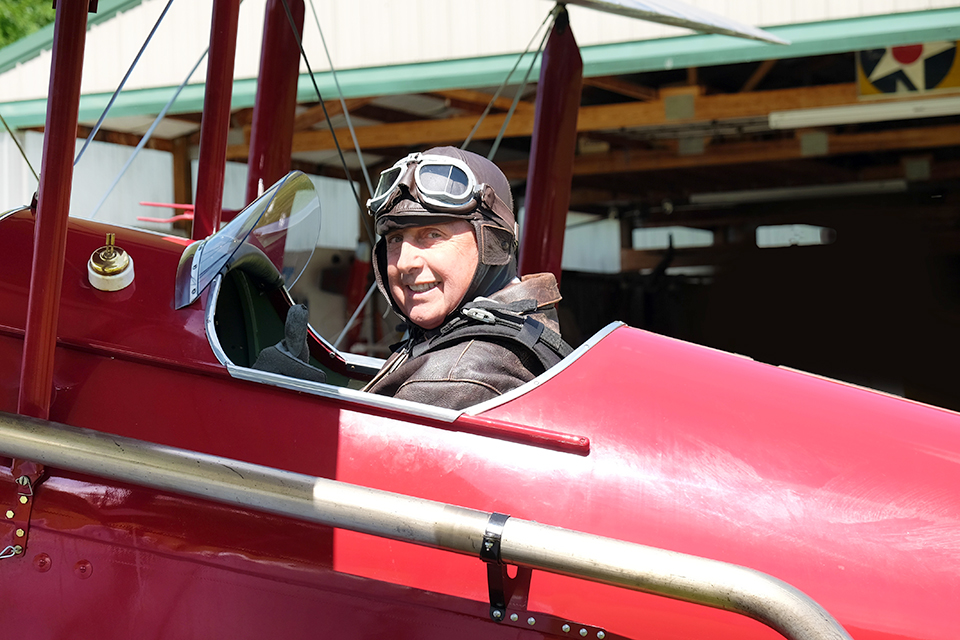 Maniatis prepares to take his red Moth for a spin. (©Tom Bucelot)