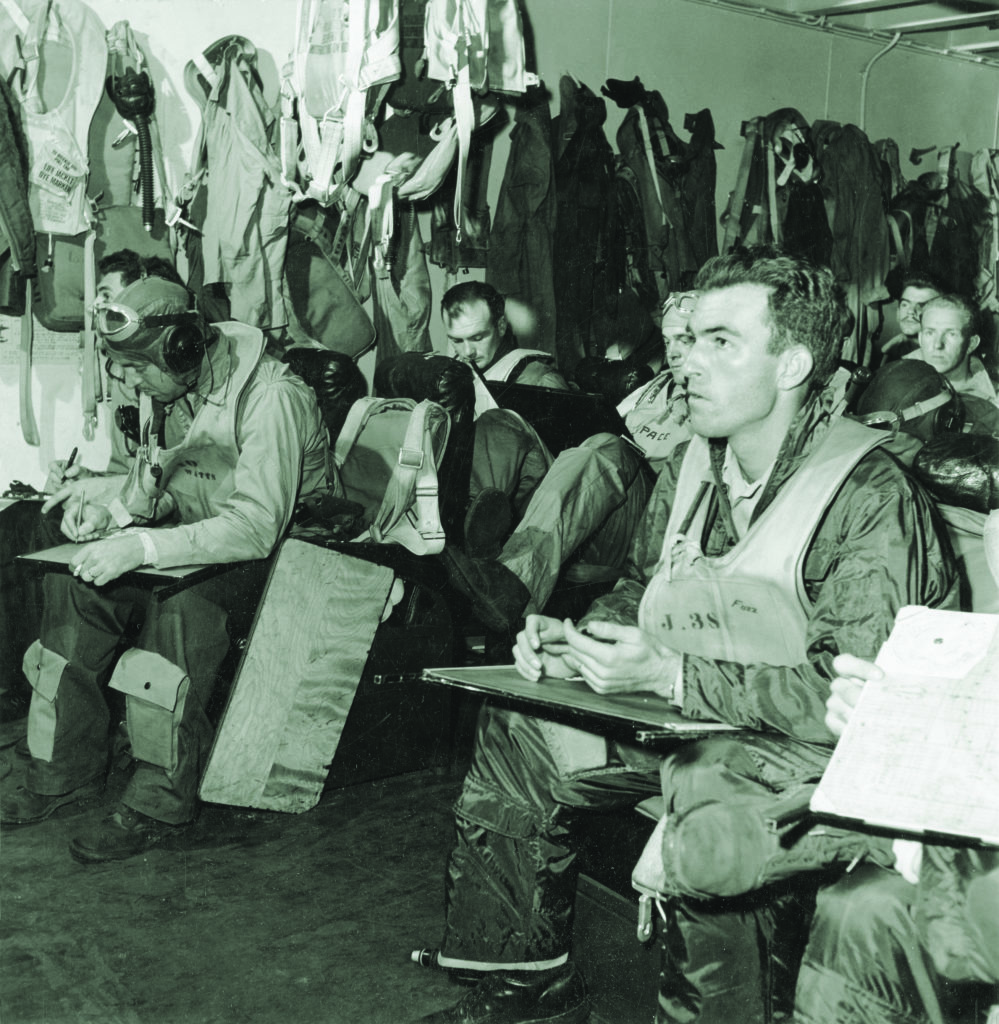 Pilots aboard the Hornet are briefed in one of the carrier’s ready rooms prior to a February 1945 operation in the South China Sea. (Charles E. Kerlee/U.S. Navy)