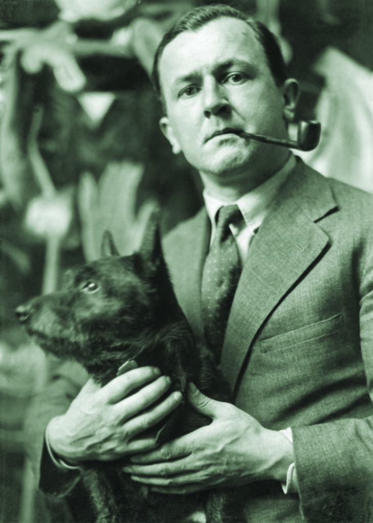 George Grosz, here in 1928 with his Scottish Terrier, believed that an artist’s most important contribution was in social criticism. (bpk Bildagentur/Ewald Hoinkis/Art Resource, NY)