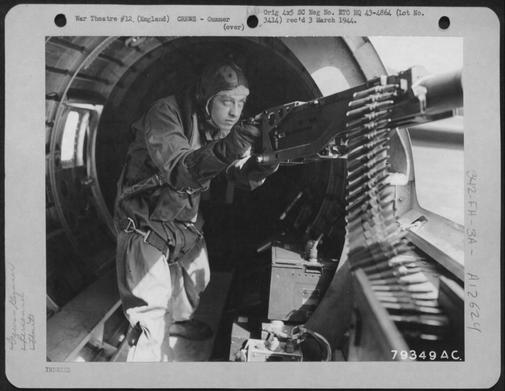 Smith, posing for publicity photos at a B-17’s waist gun, was nicknamed “Snuffy” by colleagues, an unflattering reference to a cartoon character. (U.S. Air Force/National Archives)