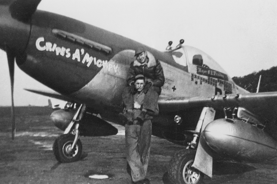 Preddy's ground crew pose in front of the ace's last "Cripes A' Mighty." (National Archives)