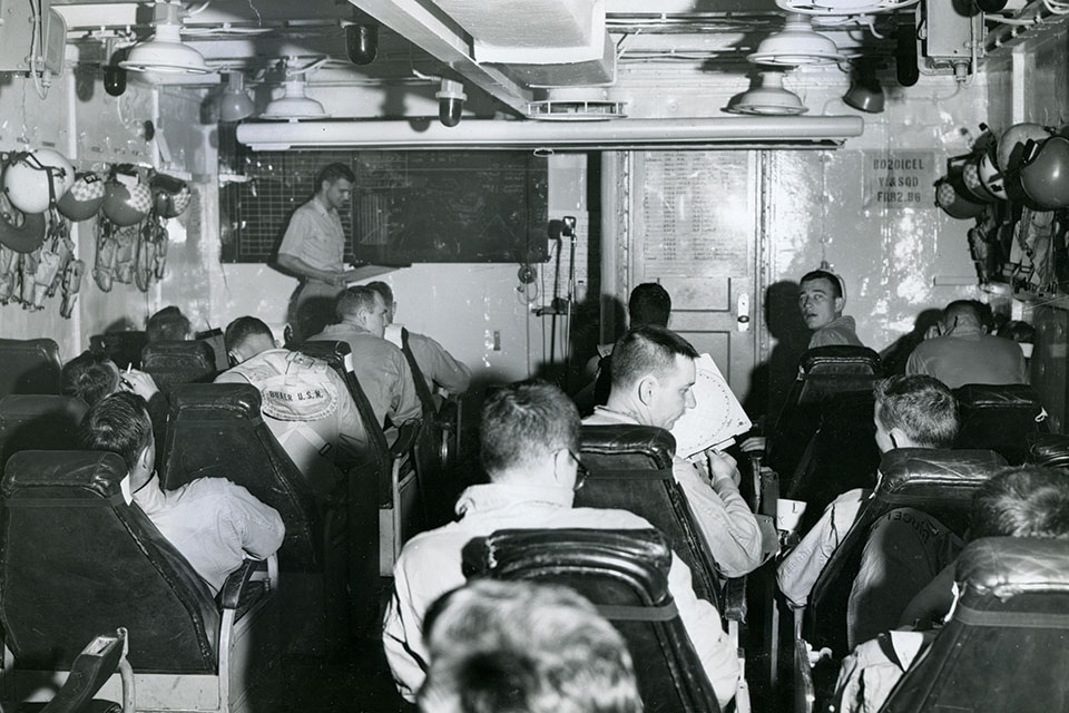 HS-5 crewmen attend a briefing in their ready room aboard Lake Champlain before embarking in HSS-1Ns on an anti-submarine mission. (Courtesy of Dan Manningham)