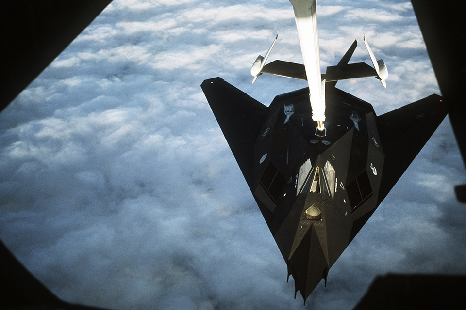 A 37th Tactical Fighter Wing F-117A refuels from a KC-10 tanker en route to Saudi Arabia. Pilots flew nonstop, a flight of approximately 18.5 hours—at the time, a record for single-seat fighters. (U.S. Air Force)
