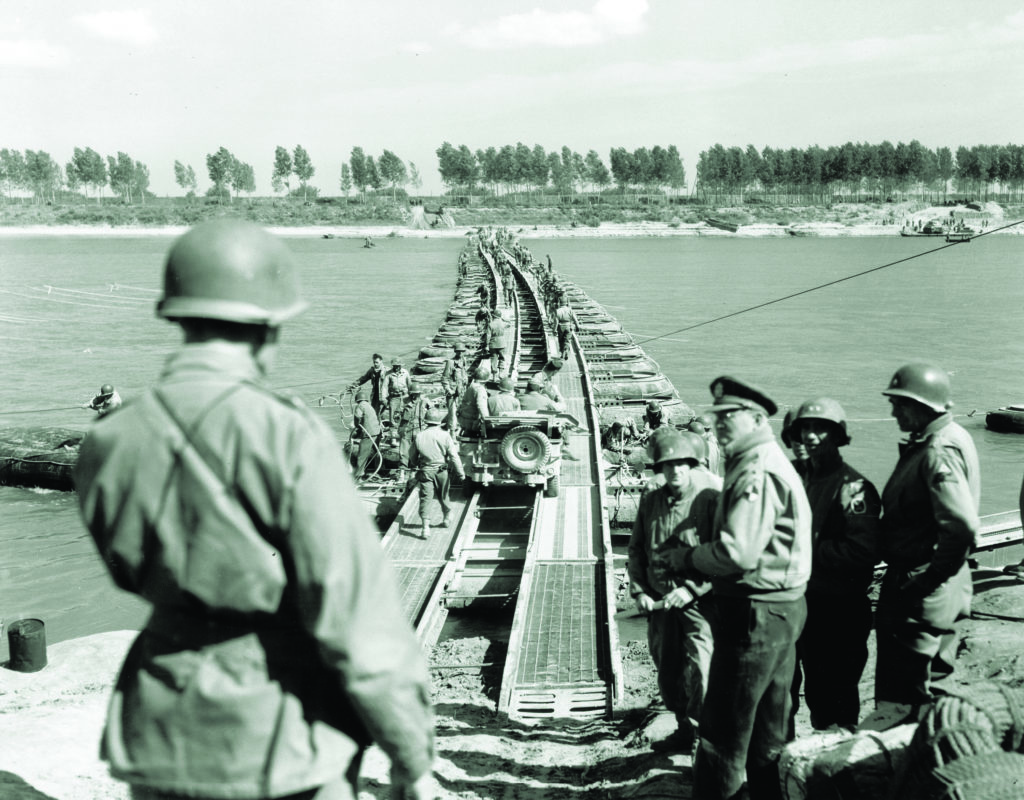 The 10th Mountain Division’s successes set the stage for an advance into German-held northern Italy. Here, engineers build a pontoon bridge across the Po River in late April 1945. (The Denver Public Library, TMD-611)