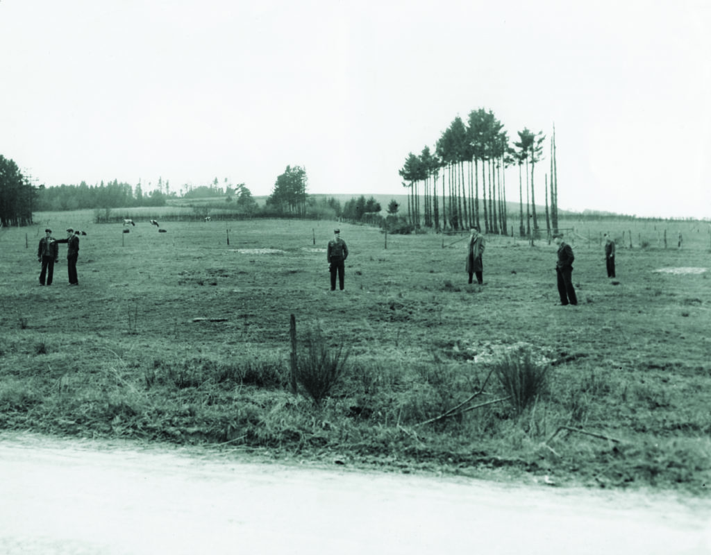Malmedy survivors brought to Germany to testify visit the field where their comrades were gunned down. (Interfoto/Alamy Stock Photo) 