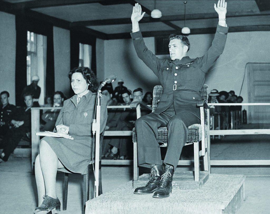 Former U.S. Army sergeant Keneth Ahrens demonstrates how he surrendered to the SS. (Ullstein Bild/Getty Images)
