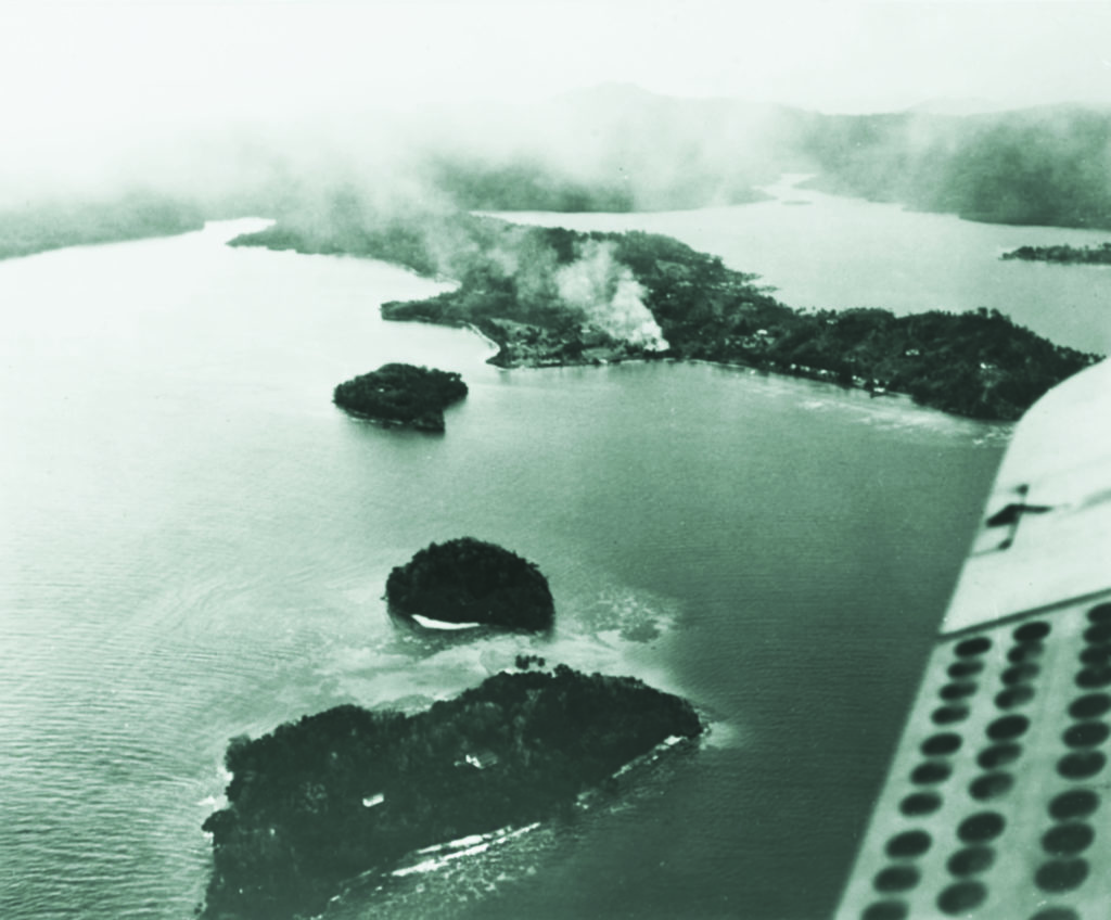 Tulagi’s cricket ground burns during the August 7, 1942, invasion of the Japanese-held island. (U.S. Naval History and Heritage Command)