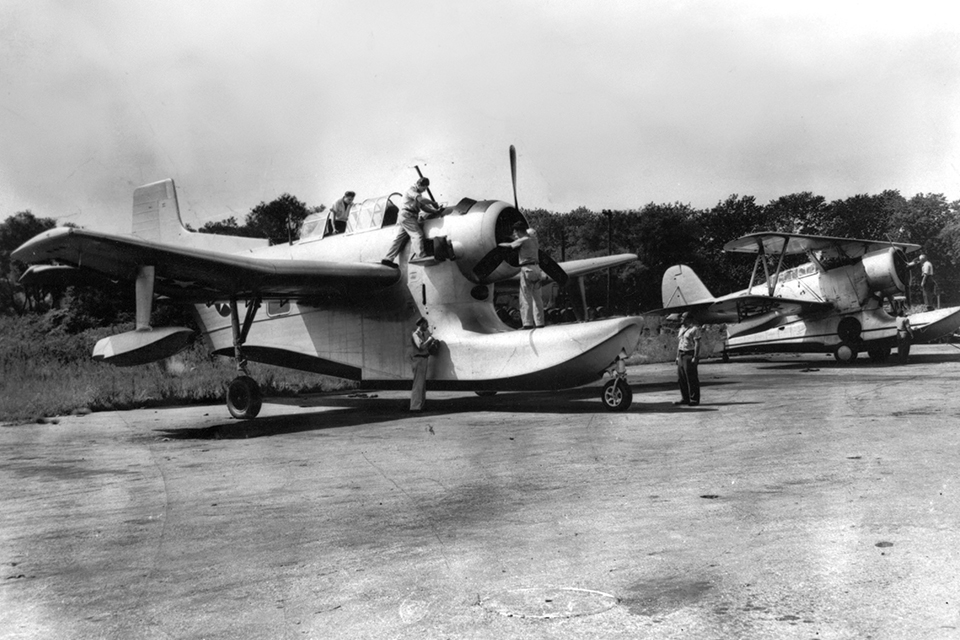 Levine's influence can be seen in Columbia's proposed monoplane replacement for the Grumman J2F Duck, the XJL-1, in the foreground of this photo. (U.S. Navy)