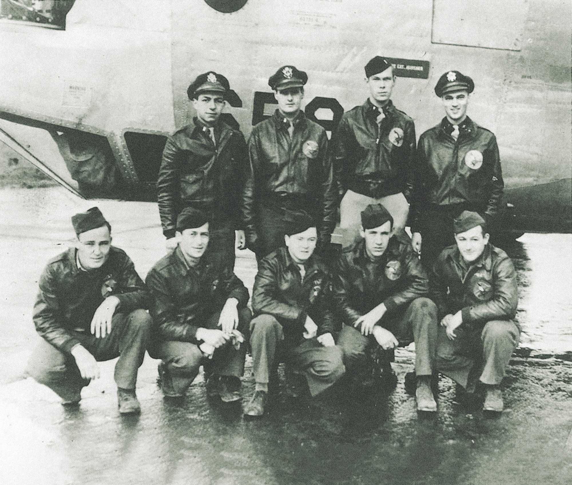 Lieutenants William R. Sincock (back row, second from left) and Theodore Q. Balides (back row, far left) and their fellow B-24H Liberator crewmen. (National Archives)