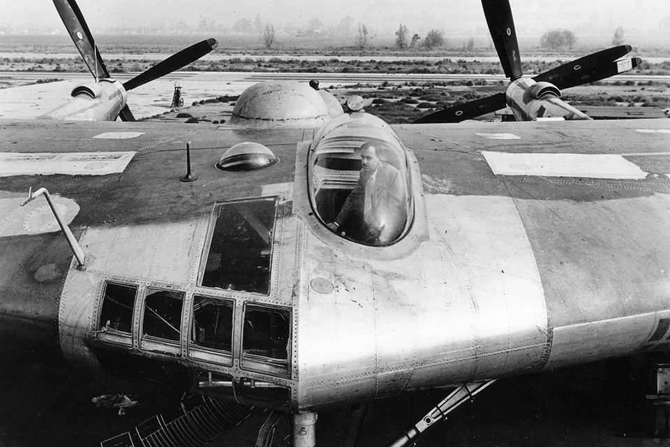 A.M. Schwartz, Northrop’s chief of structures, stands in the pilot’s bubble canopy of the XB-35. (NAtional Archives)