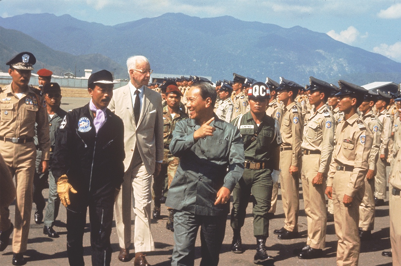 South Vietnamese President Nguyen Van Thieu, pointing, and U.S. Ambassador Ellsworth Bunker walk by South Vietnamese troops in 1969. During Tet, most of Thieu’s commanders had left for the holiday. (Larry Burrows/Time/Magazine/The Life Picture Collection via Getty Images)