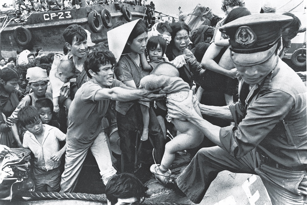 Refugees from Da Nang and other areas overrun by the NVA arrive by boat at Vung Tau, a port near Saigon, on April 3, 1975. (The Asahi Shimbun via Getty Images)