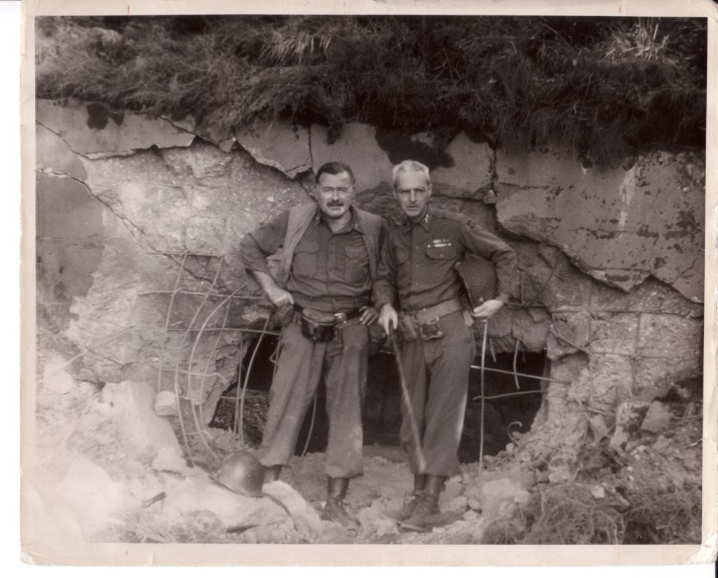 Hemingway and Lanham, here outside a German bunker, maintained a friendship until the writer’s death in 1961. (Culver)