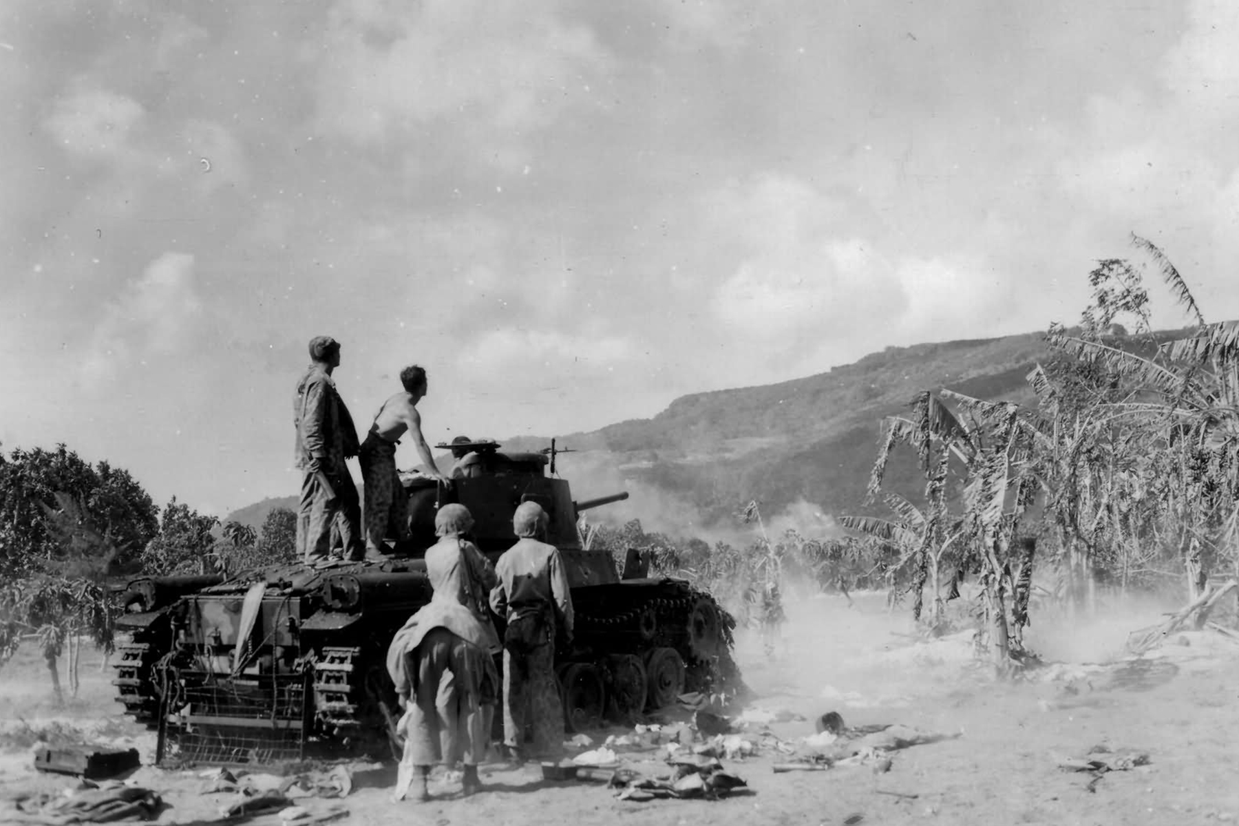 Marines with the 2nd Marine Division use a captured Japanese tank in Saipan in 1944. (Department of Defense/USMC)