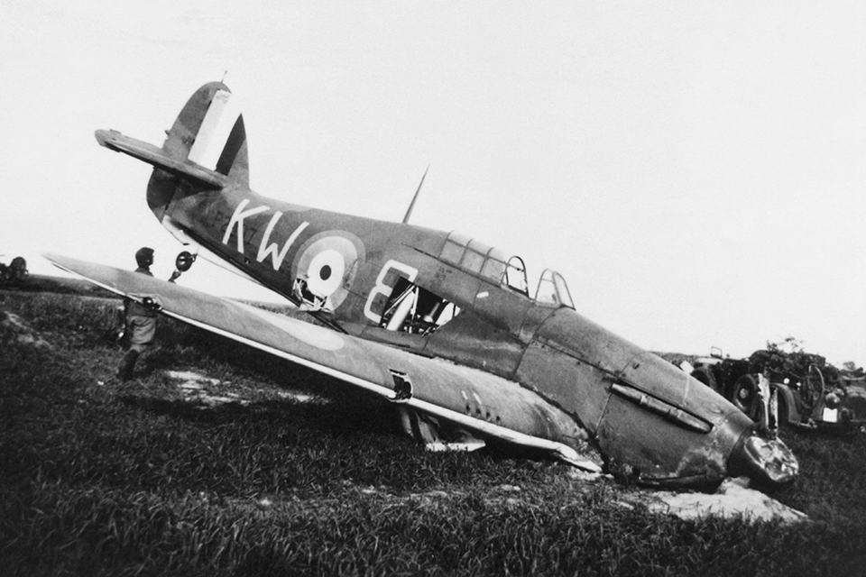 A Luftwaffe officer examines a crash-landed RAF Hawker Hurricane. (Mary Evans Picture Library)
