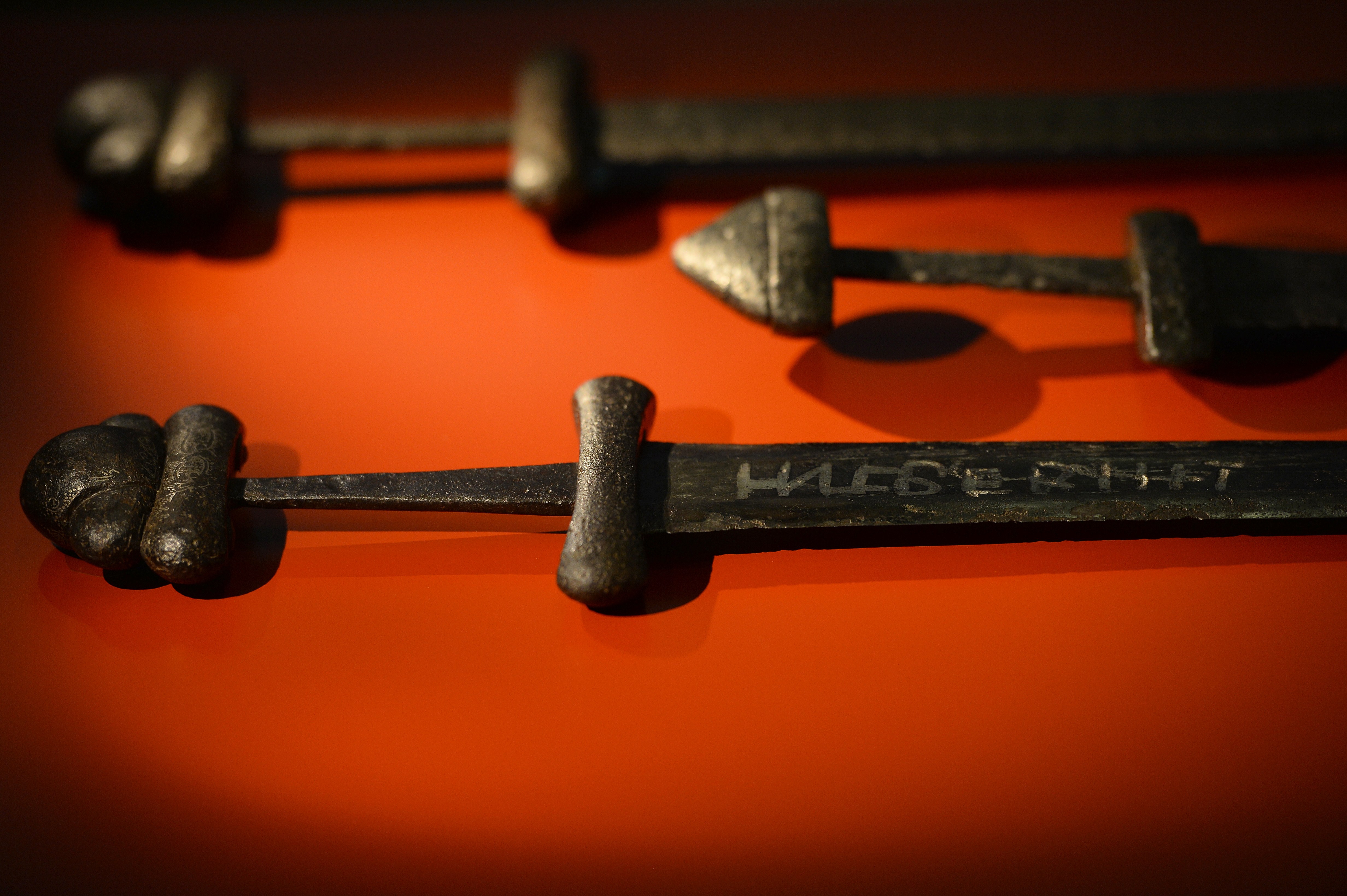 A Viking 'ulfberht sword' (Foreground) originating from Russia, and dating back to 900-1000 AD is pictured duing a photocall for the 'Vikings: Life and Legend' exhibition at the British Museum in London, on March 4, 2014