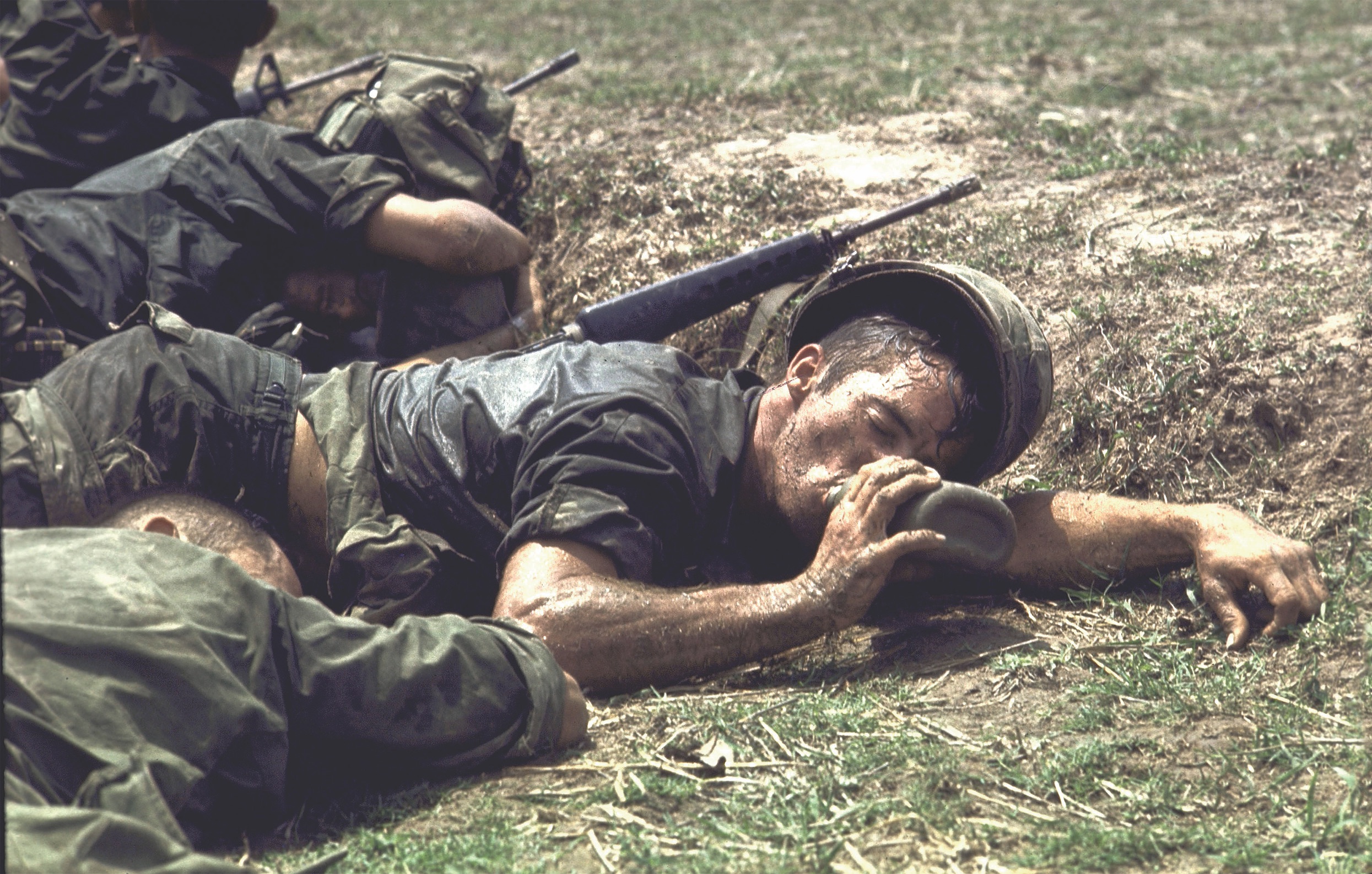 After tough fighting in the Fishhook area, U.S. soldiers from an unidentified unit get a rare chance to rest and take a sip of water. (Larry Burrows/The Life Picture Collection via Getty Images)