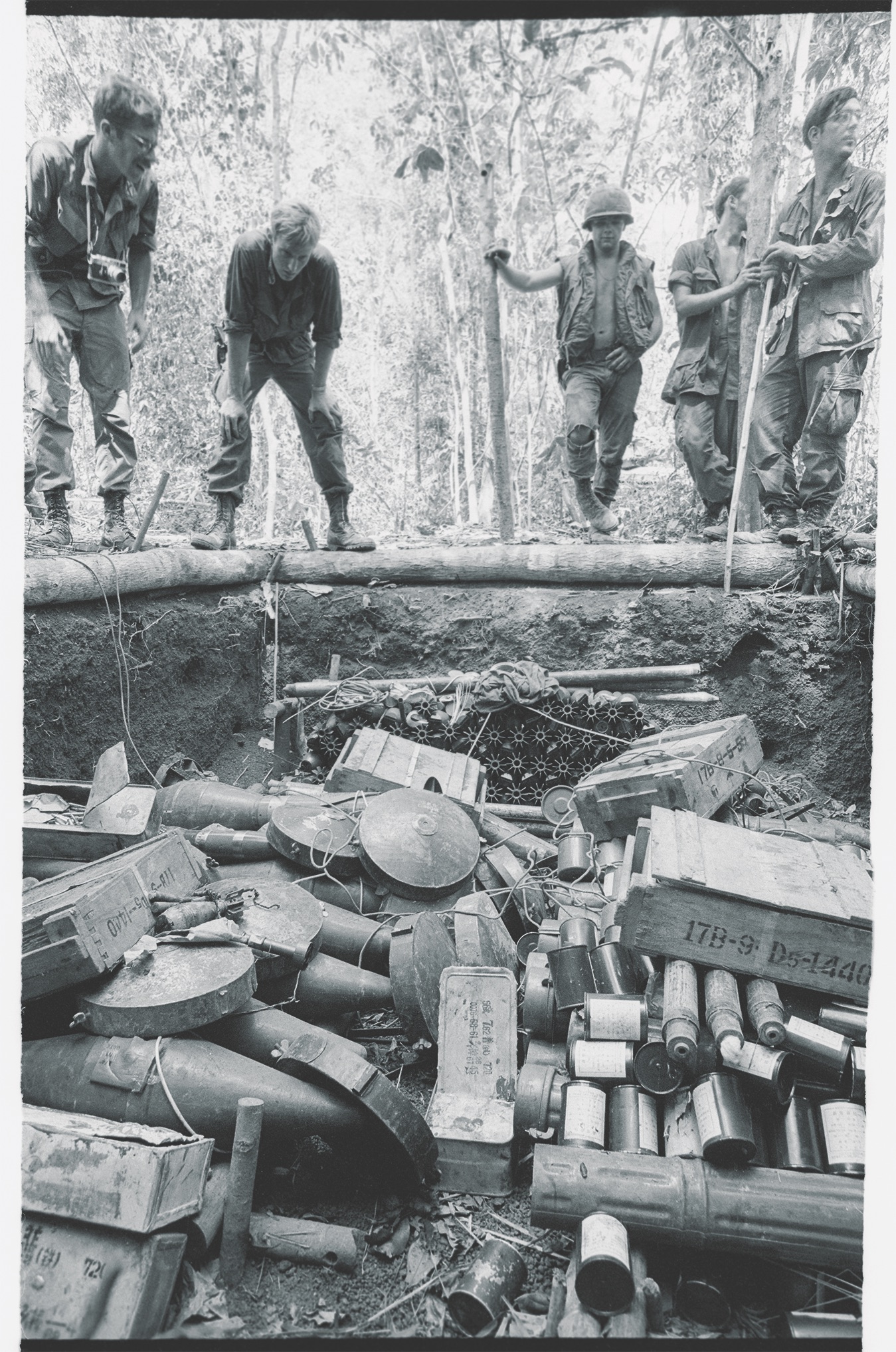 A pit filled with communist supplies, including rockets and mortar shells, is discovered on May 3 in the Fishhook area by 11th Armored Cavalry troops. (Bettmann/Getty Images)