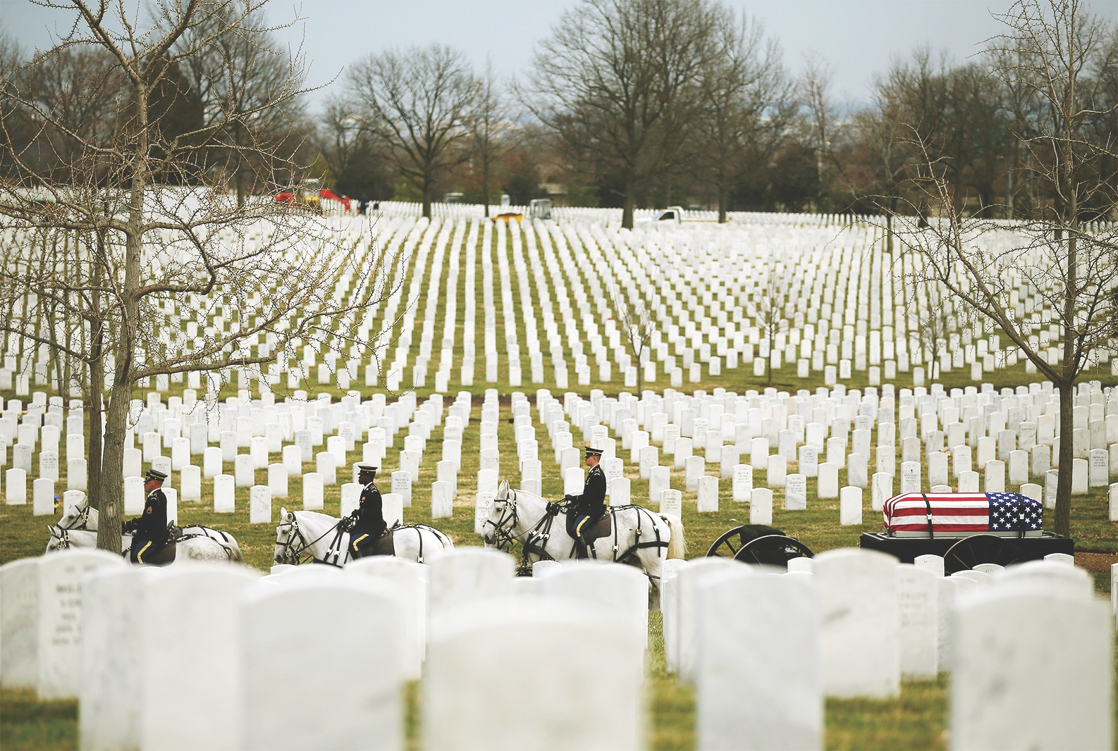 A funeral service at Arlington National Cemetery on March 21, 2014, honors seven men whose remains are being buried five decades after they were killed in a 1964 helicopter crash in Vietnam. (Mark Wilson/Getty Images)