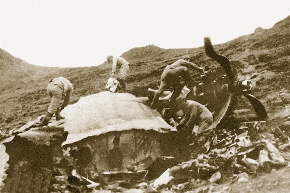 Japanese troops swarm over the wreckage of Todd’s Liberator. (Author’s collection)